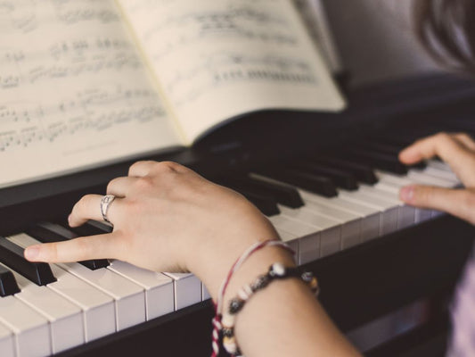 Hands playing piano
